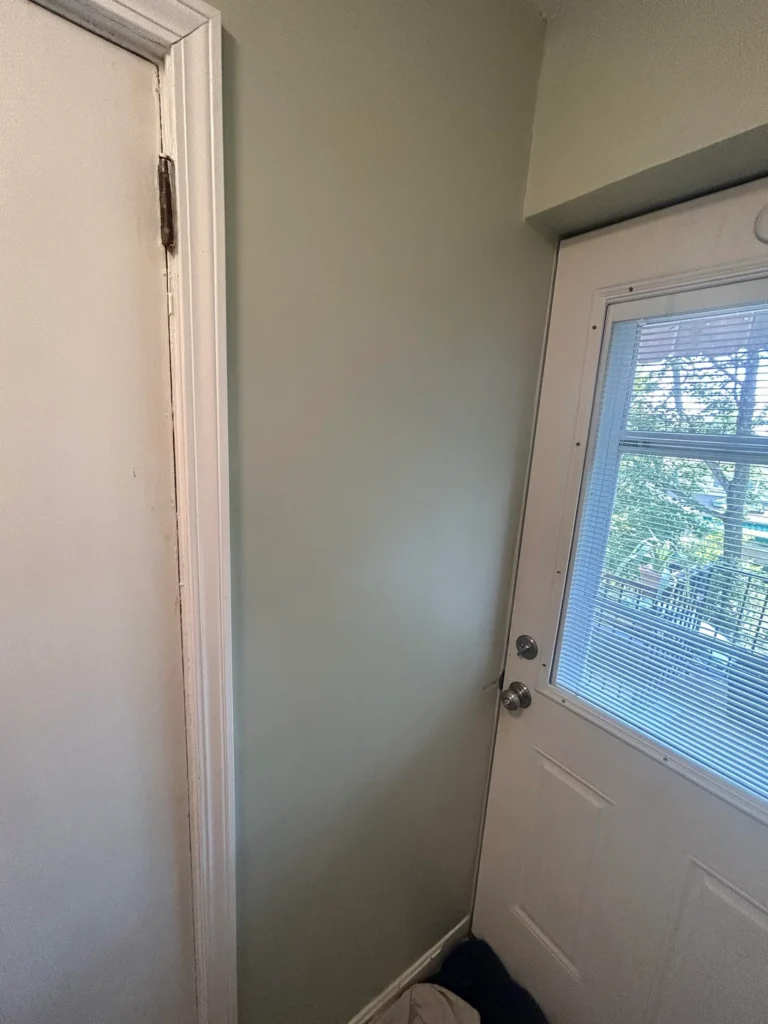 Interior wall after drywall patching and paint finishing