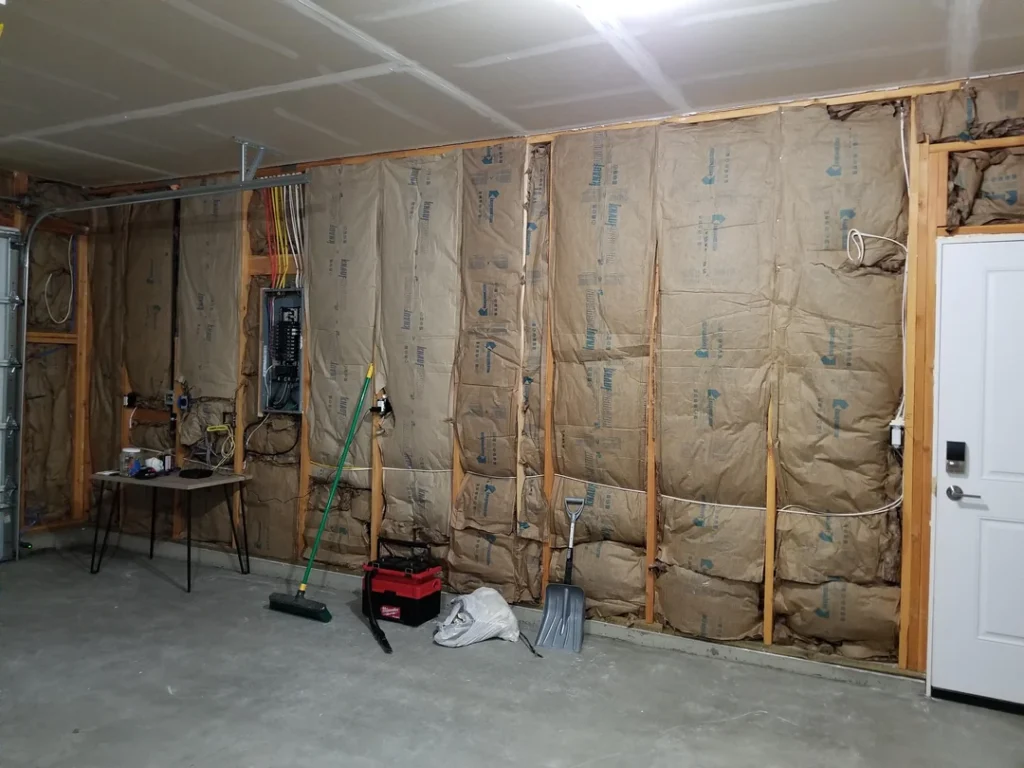 Garage wall insulation and framing before drywall installation